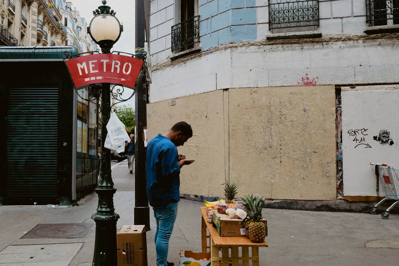 A fruit stall by a Métro entrance.