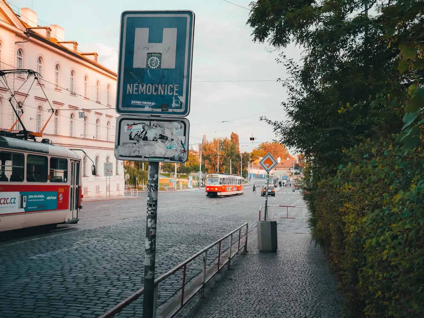 A tram on a cobbled Prague street.